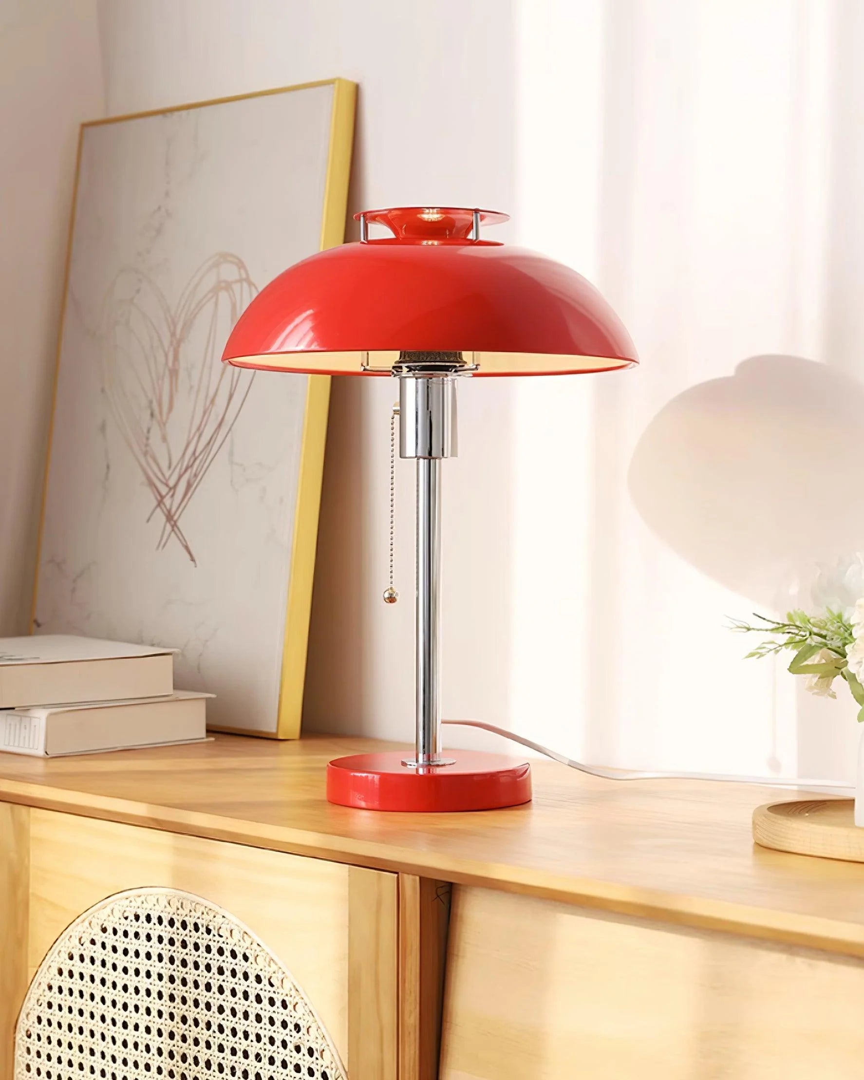 Zenviae Bowie Table Lamp on desk with books and lamp lit