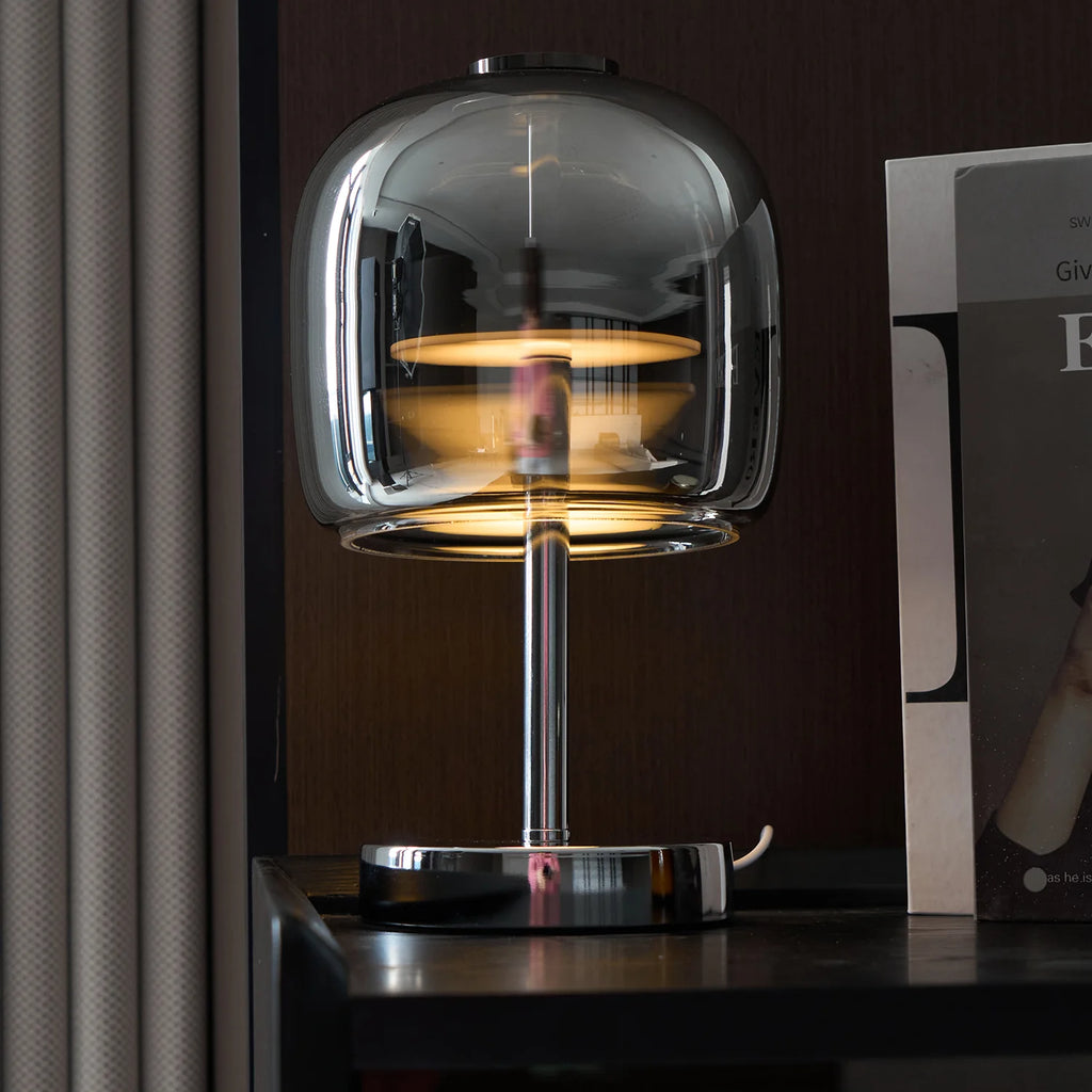 Zenviae Glow Jar Table Lamp glowing in modern dark-toned living room