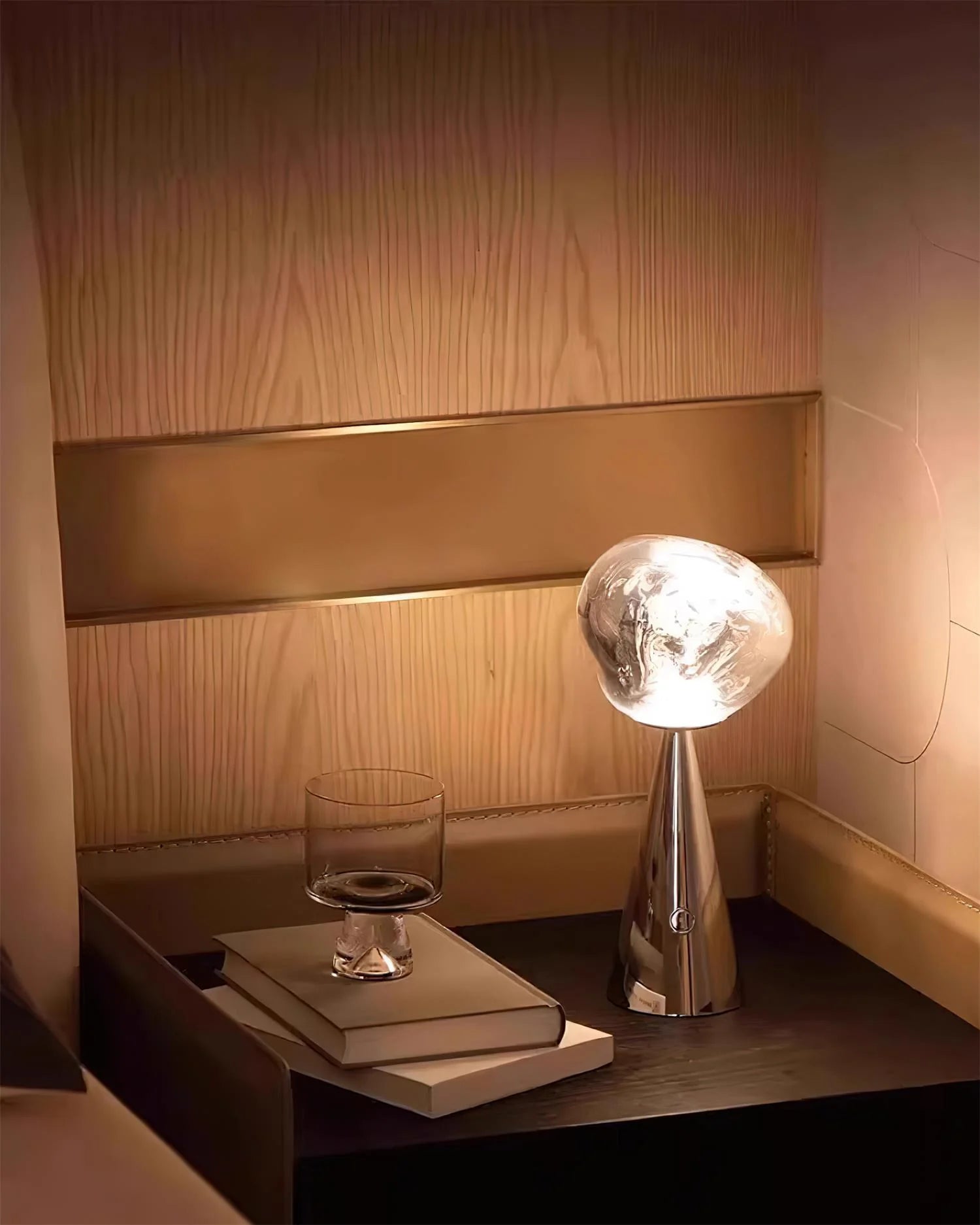 Zenviae Lava Charge Table Lamp on wooden shelf lit in warm light