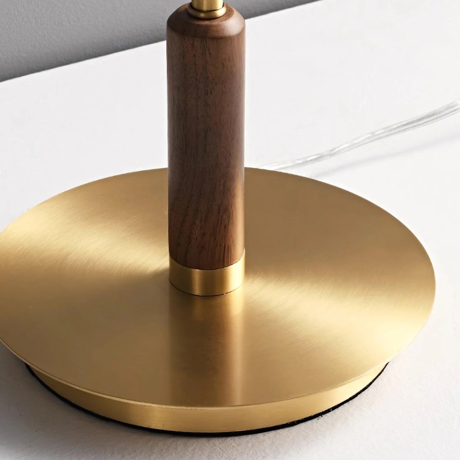Zenviae Orbit Glow Table Lamp close-up of golden brass base and walnut accent